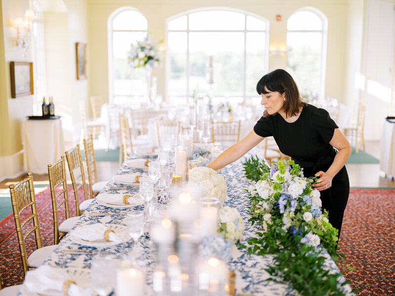Wedding coordinator preparing an elegant reception
