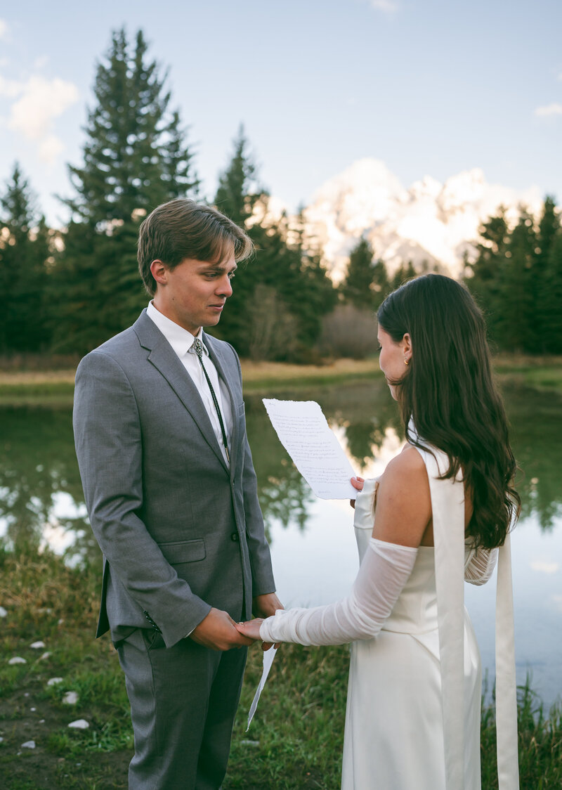 grand tetons elopement, bride and groom share vows at schwabacher's landing