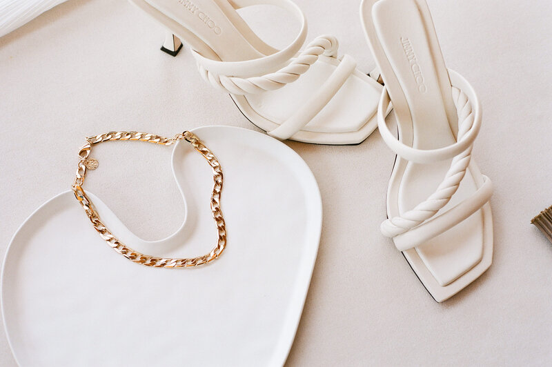 Flatlay image of upscale wedding jewelry and accessories