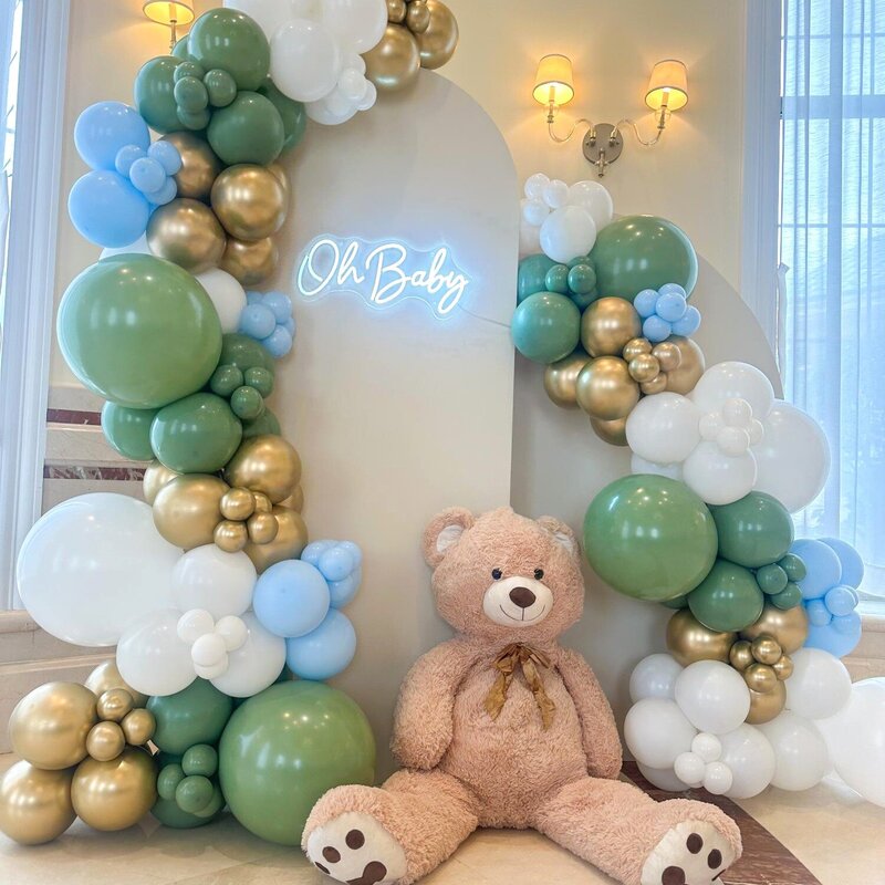 green and gold baby shower decor with teddy bear in Chicago
