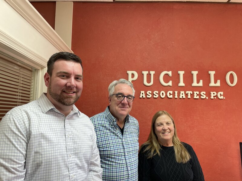 Picture here are Mike Pucillo (middle), P.J. Pucillo, and Janet.