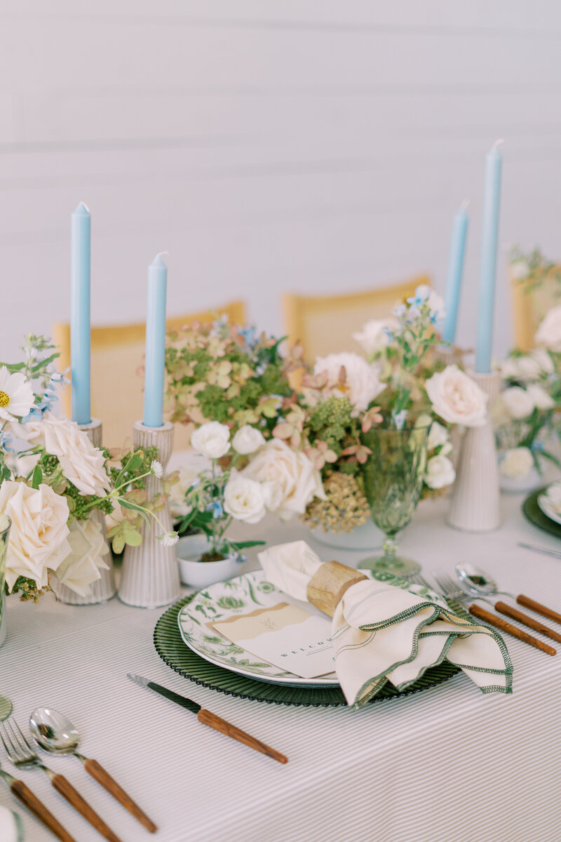 A perfectly pastel table setup with custom wedding stationery by Eventive Designs ATX.
