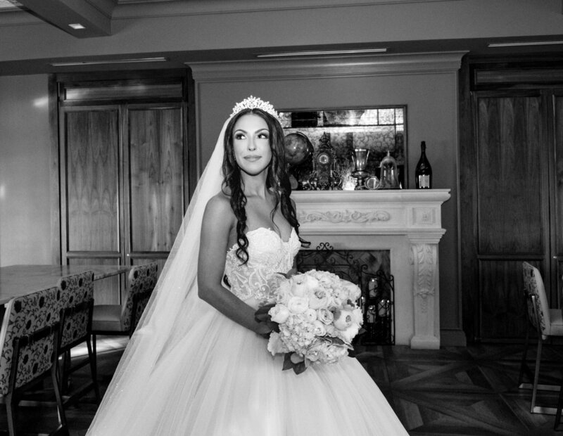 black and white image of bride holding classic wedding bouquet