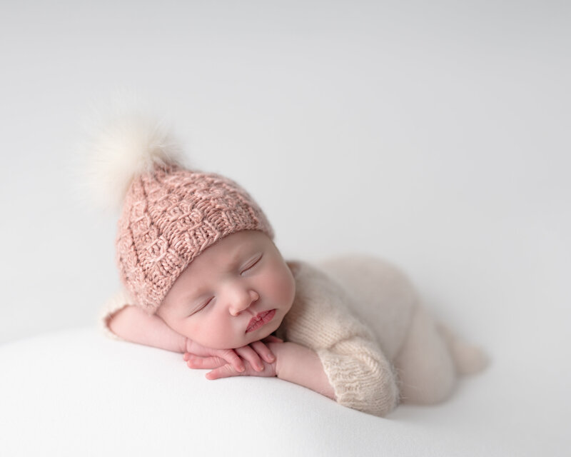 A dreamy newborn portrait with soft textures and cozy winter tones, perfect for celebrating your baby’s first days.