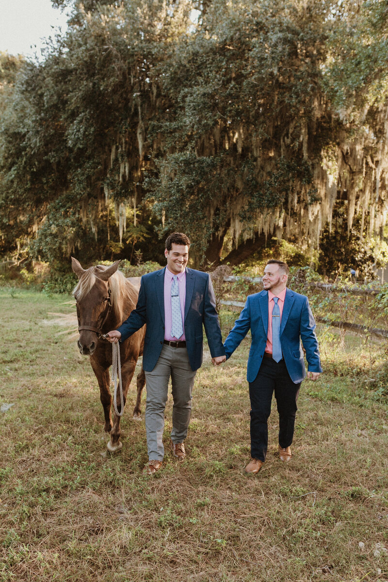 Engagement photography by Lisa Staff on horse ranch in Beaufort SC with horse stables