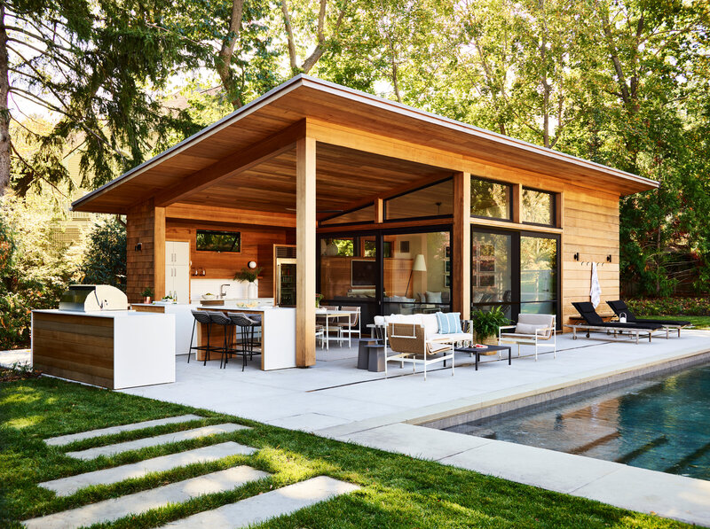 Explore a well-designed modern pool house, as seen in New England Home magazine, featuring classic, timeless, and curated elements.