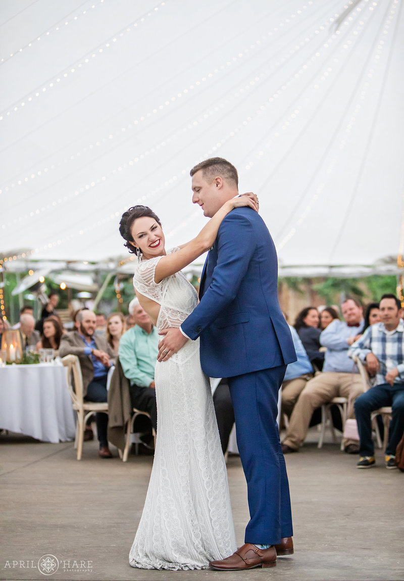 Couple's first dance in big white tent at Blackstone Rivers Ranch