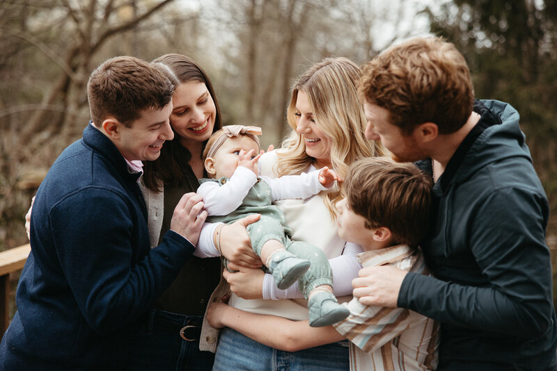 Portrait of adult siblings with their partners and children taken during an extended family session in St. Louis, Missouri. 