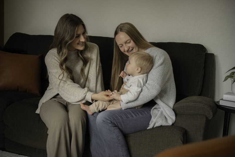 lactation consultant interacting with a mother and her son