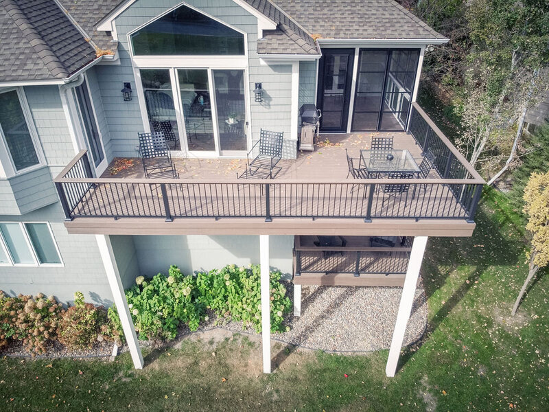 Aerial view of a composite deck supported by tall beams wrapped in Azek PVC. 