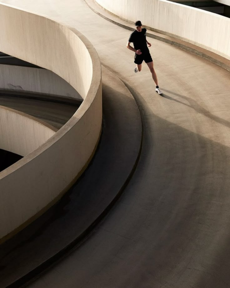 Athlete running outdoors with improved mobility and reduced pain after acupuncture treatment