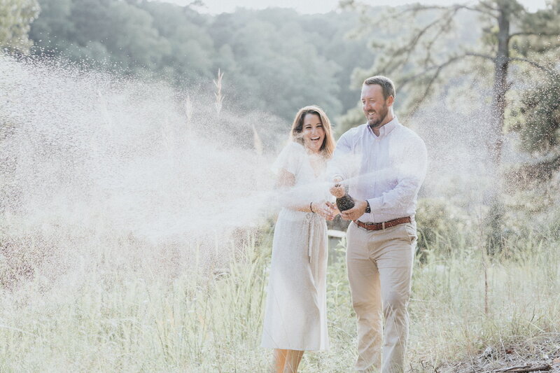 Champagne celebration during engagement photo session