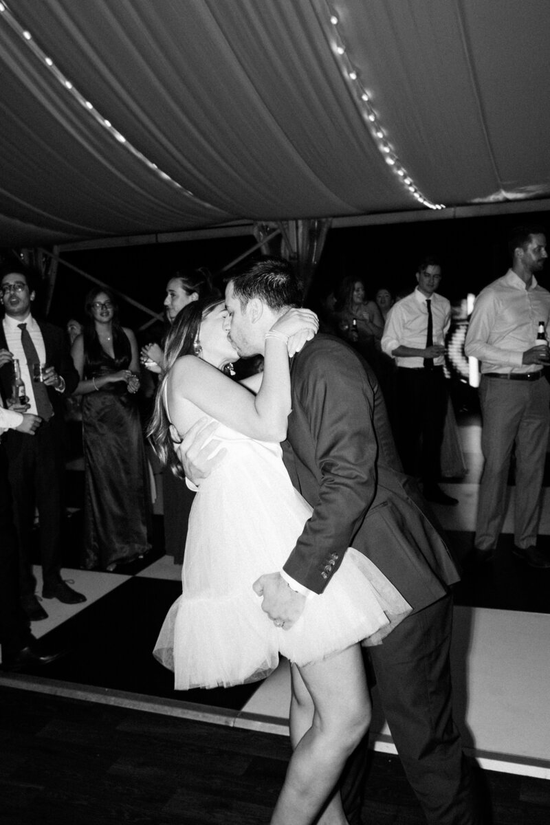 Blurry photo of bride and groom running inside at the end of the night at Glen Foerd Estate in Philadelphia, PA