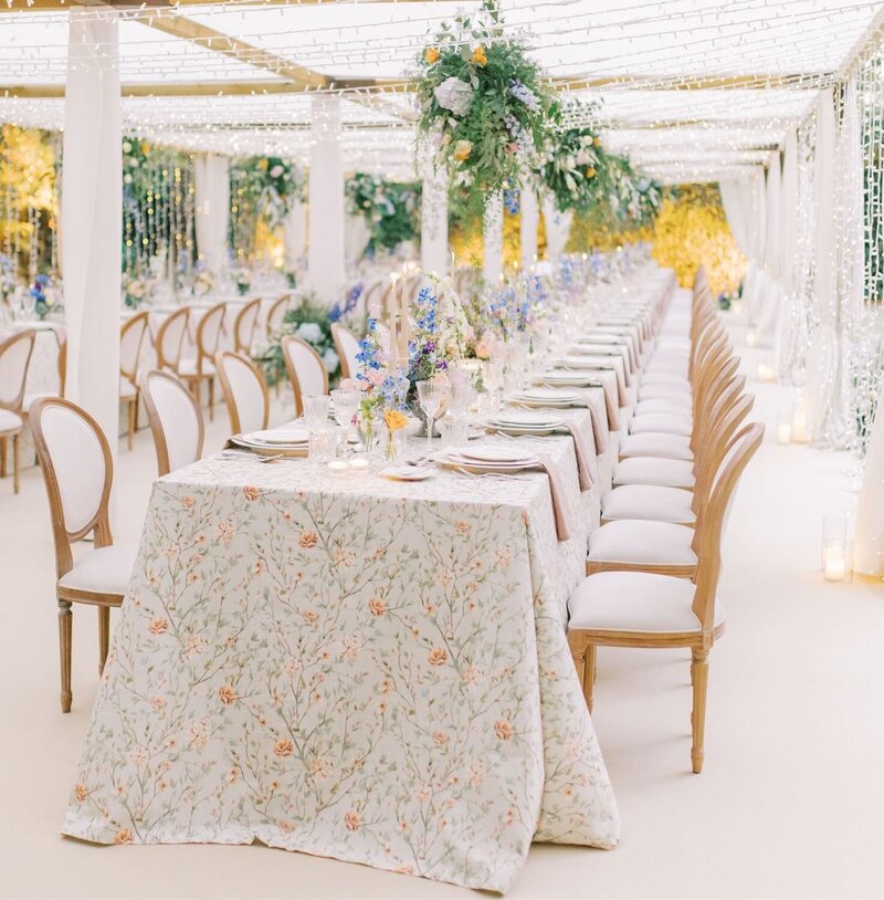 Floral filled tablescape with a fairylight tunnel for a Portugal destination wedding
