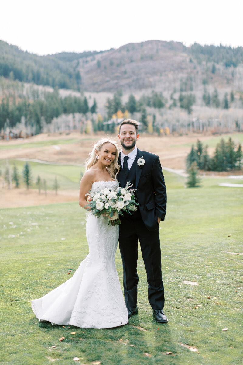 Golf course wedding photos of a bride and groom before their wedding at Donovan Pavilion in Vail Colorado.