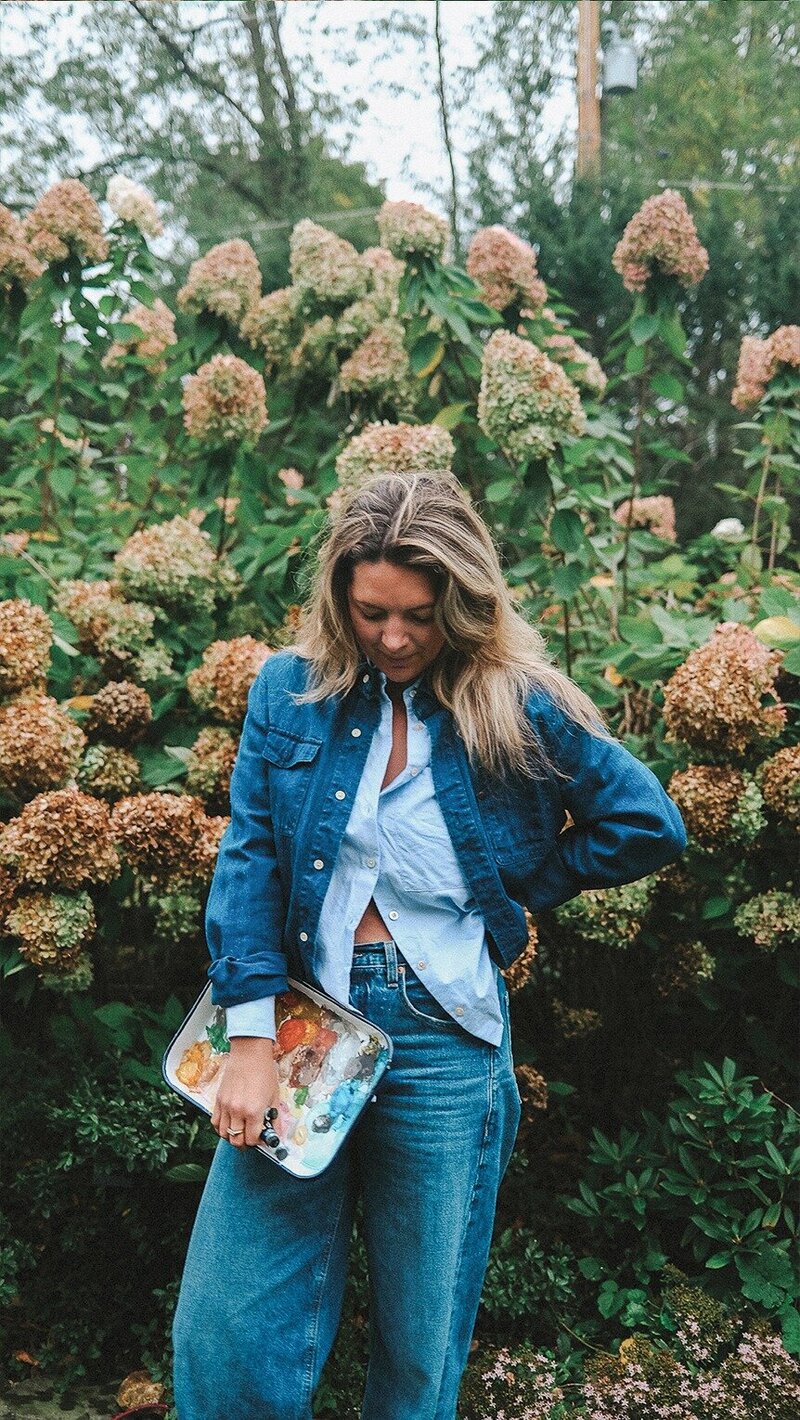 Image of east Coast stationery designer standing with paint palette 