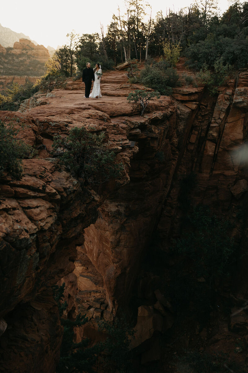 couple standing on devil's bridge on their wedding day