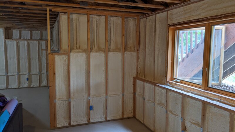 outdated kitchen with white cabinets and wood floors