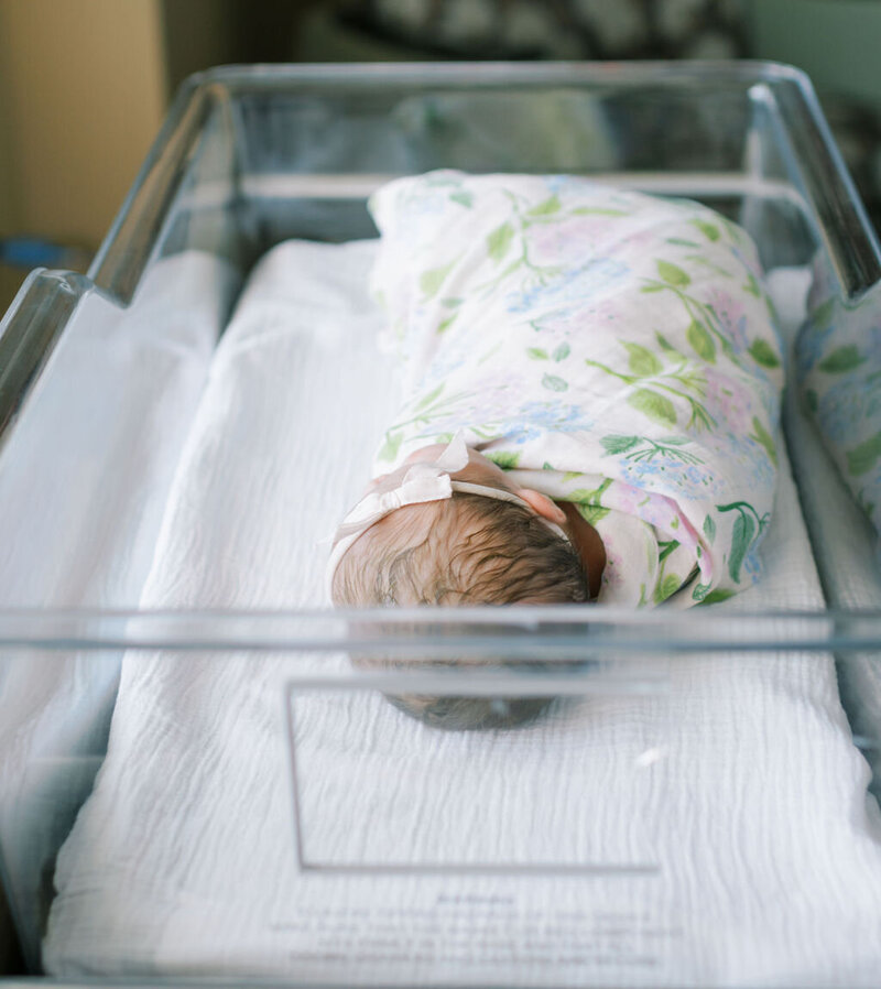 newborn in the hospital bassinet