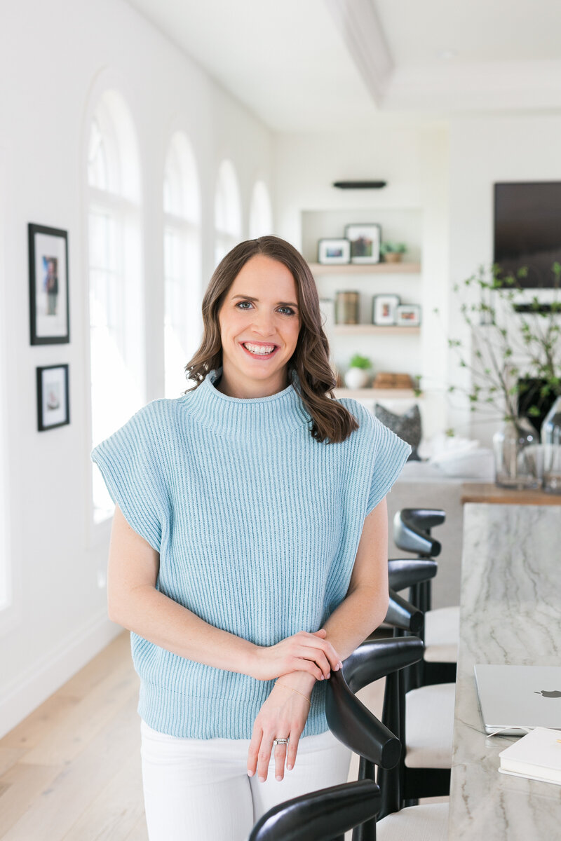Amanda smiling in a blue sweater