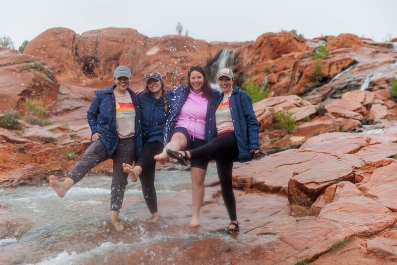 group of women splashing water with their feet