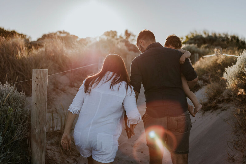 family walking off into the sunrise after maternity session. Karin Nagel - family photographer Fremantle