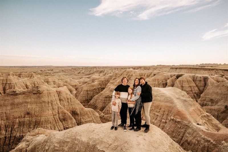 A landscape portrait of family standing in the Badlands,South Dakota