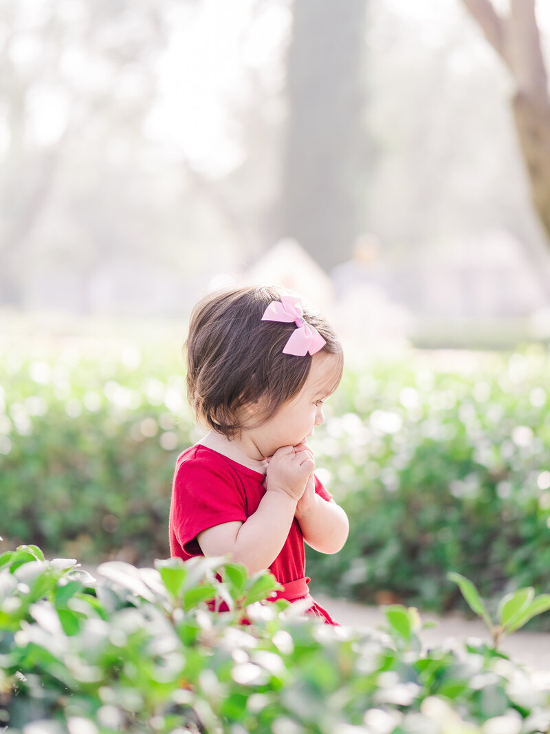 two year old girl wearing red dress