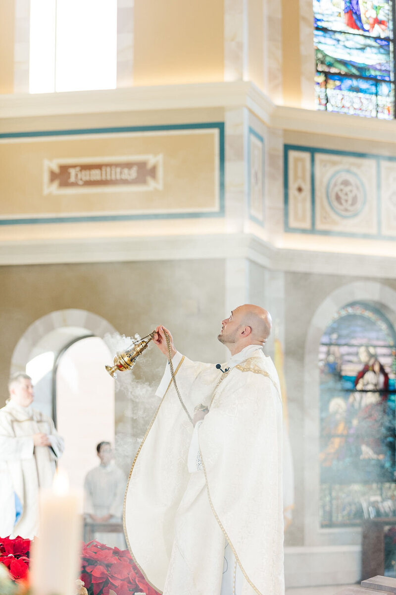 a Catholic church official participating in a wedding ceremony