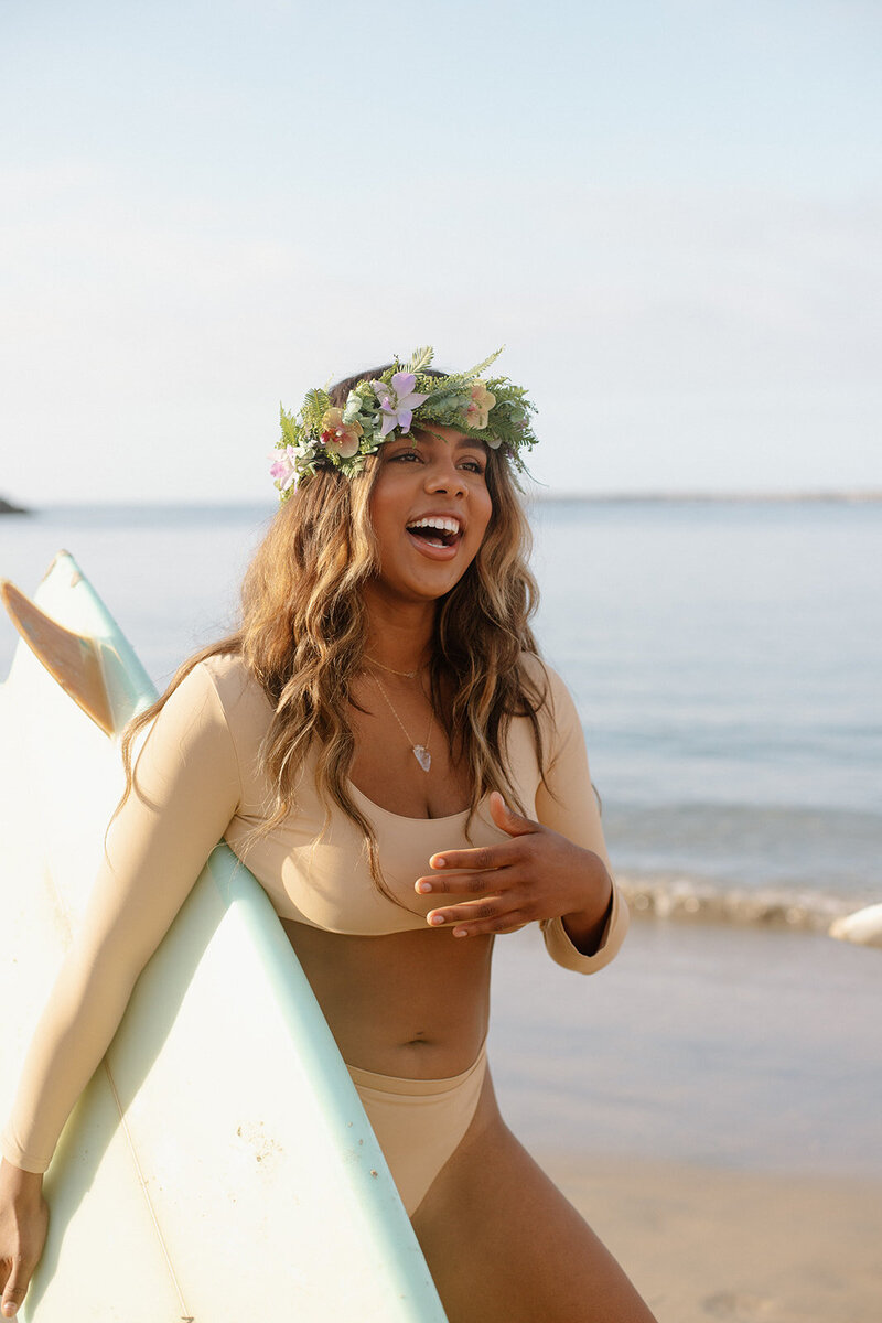 a woman on the beach for a swimwear brand photoshoot in California