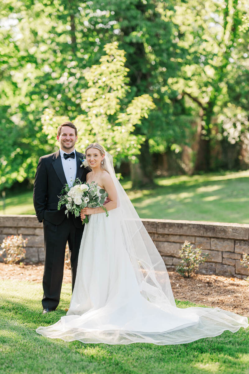 Newlyweds laugh during their first dance on their wedding day at the Presley House Riverview