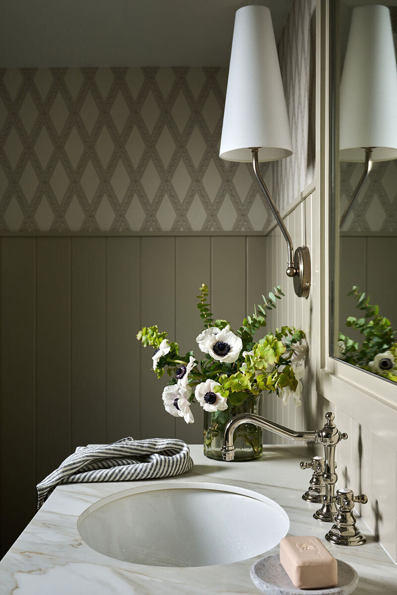 Bathroom detail with patterned wallpaper and modern colors
