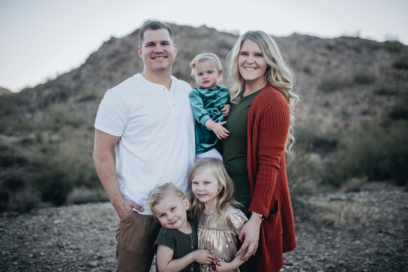 Idaho Falls family photographer poses with her family for a fall family session in the mountains
