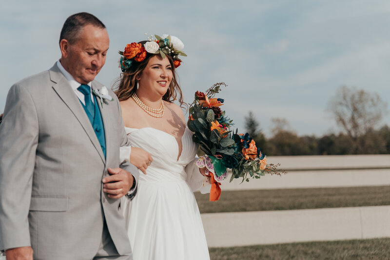 bride and groom smiling and hugging