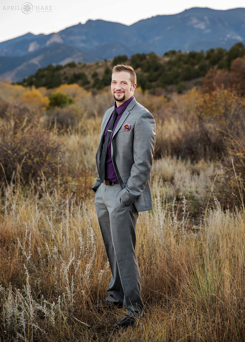 Groom poses for a portrait at Garden of the Gods in Colorado Springs