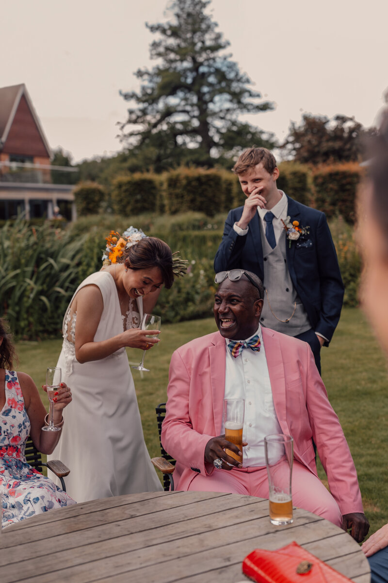 Wedding photographer captures couple taking a stroll hand in hand at their french chateau wedding.