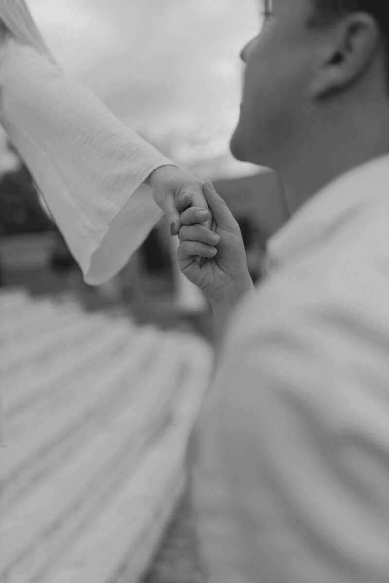 Man and woman holding hands