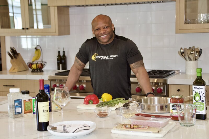 man in kitchen preparing healthy meal
