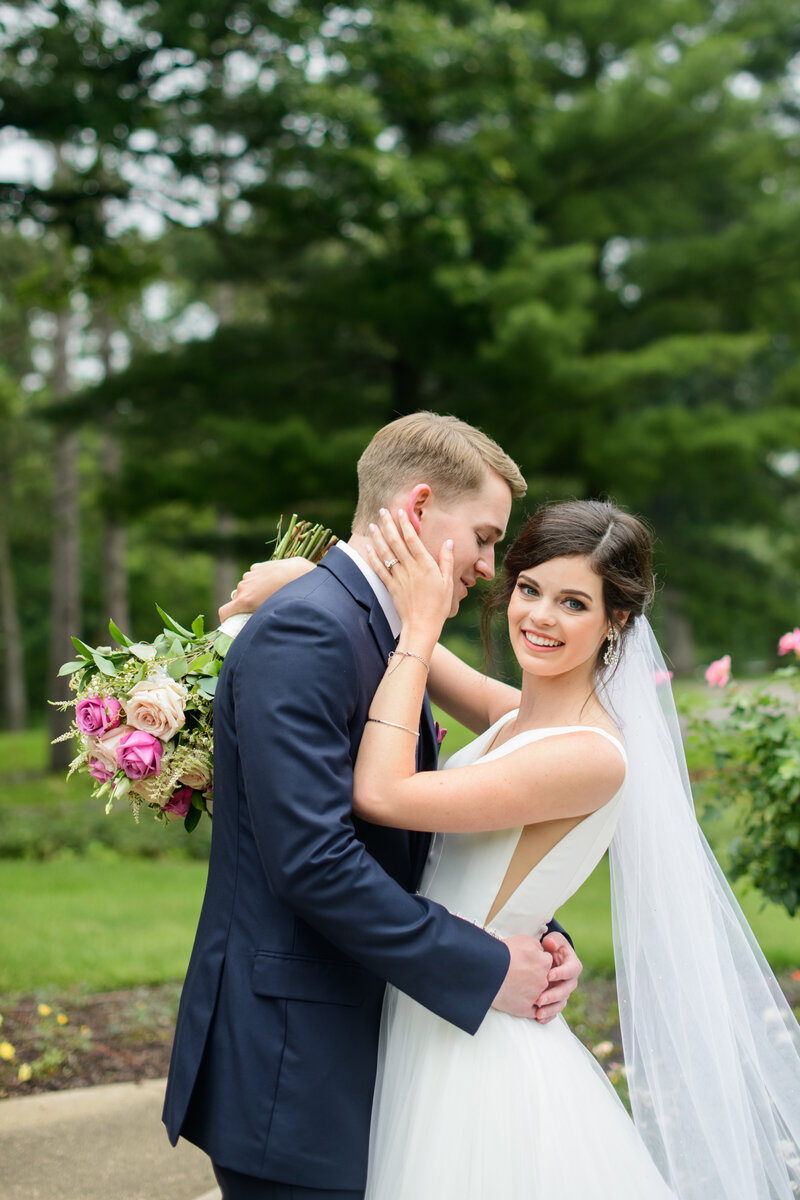 Bride and Groom Portrait surrounded by beautiful pink roses