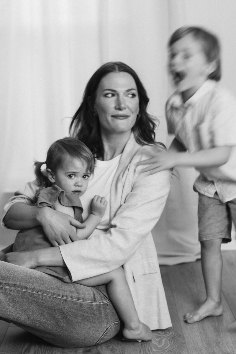 Mom with her son and toddler daughter in her lap