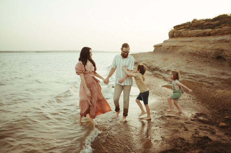 family photos playing at the lake