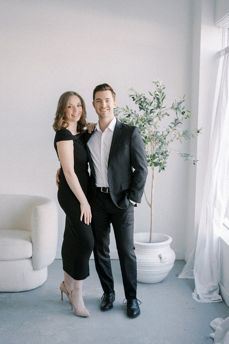 Editorial Catholic wedding photographers Colette and Tom smiling at the camera in Indianapolis