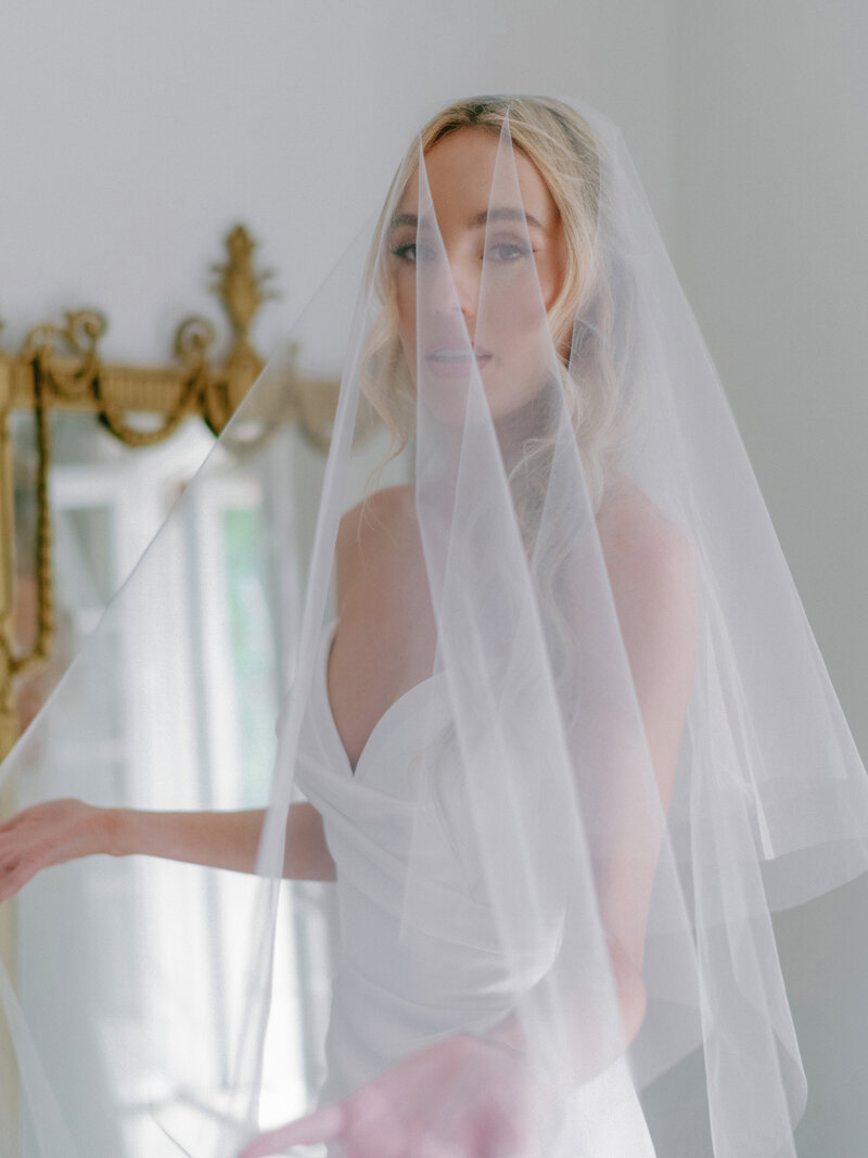 Editorial bridal portrait of a bride getting ready at The St. Regis Atlanta