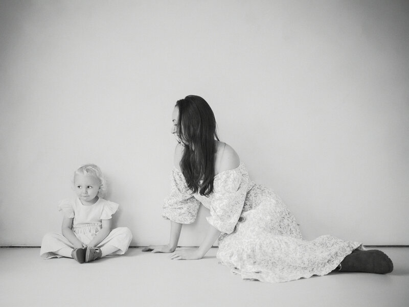 Mother and daughter sitting next to each other at a studio in Vancouver