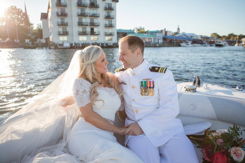 Naval Academy wedding photo of bride and groom on boat in Annapolis, Maryland Chesapeake Bay by Christa Rae Photography