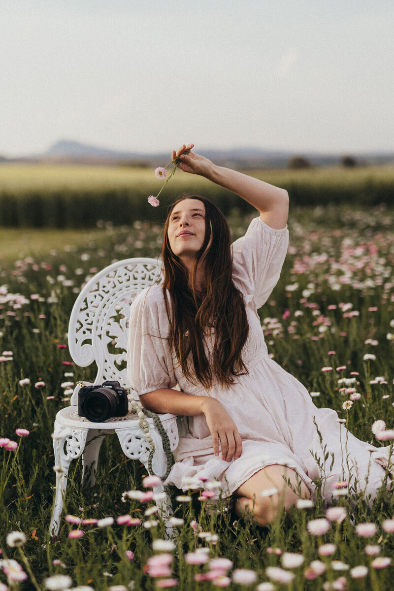 Your Brisbane Family, Newborn and Maternity Photographer, Courtney Blury, pictured in a field of daisies