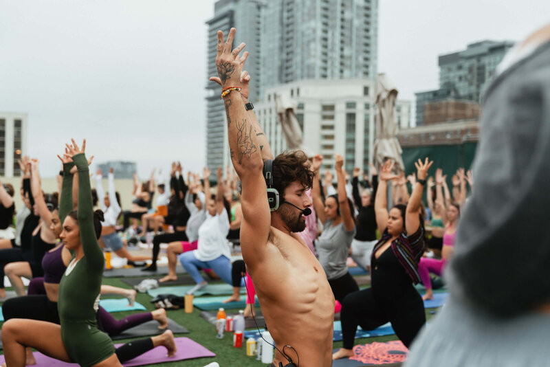 Male teacher leading a yoga flow