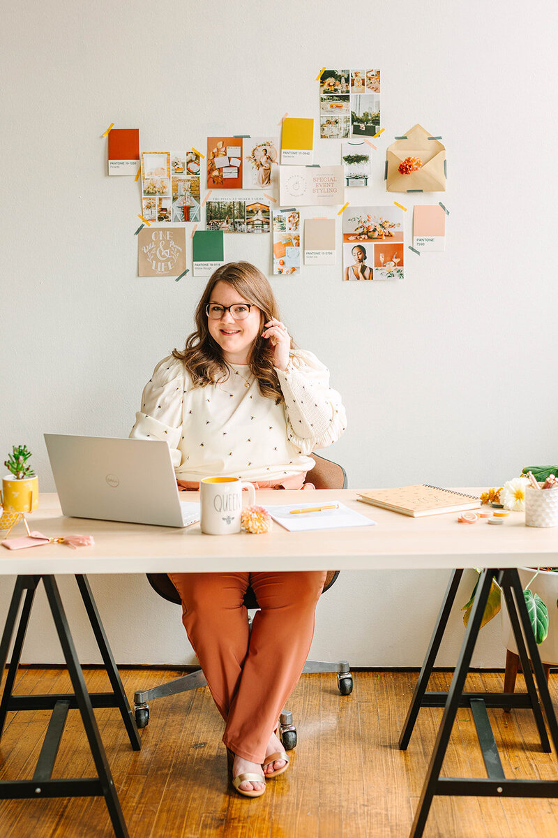 Katelynn Durbin, owner of Her Humble Hive sitting at a desk