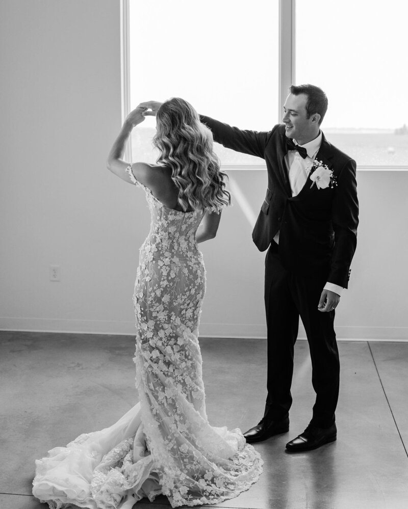 The bride and groom share a special first look moment at the August House Venue.