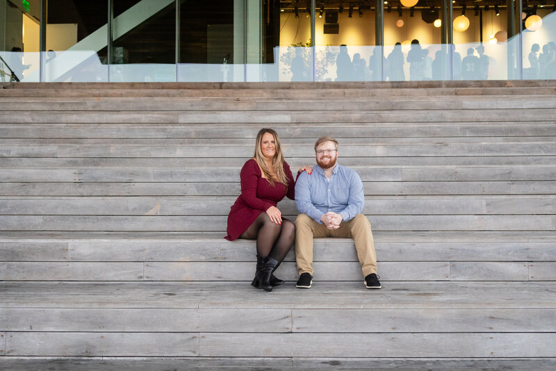 city-engagement-couple-on-steps-of-ica-seaport-lisa-gilbert-photography